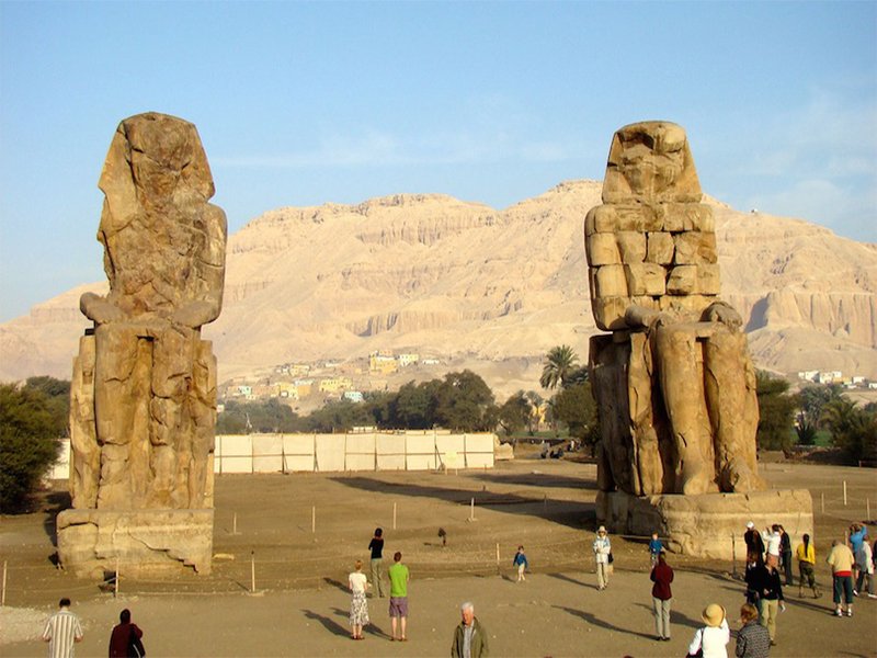 Two giant statues of Pharaoh Amenhotep III known as the Colossi of Memnon