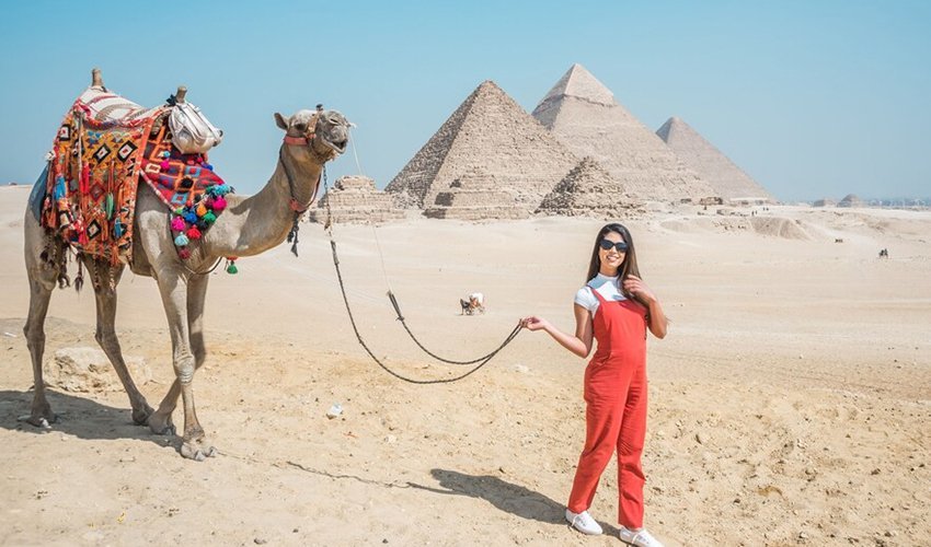 “Travelers visiting the Pyramids of Giza during a 4-day budget Egypt tour across Cairo, Luxor, and Aswan.”