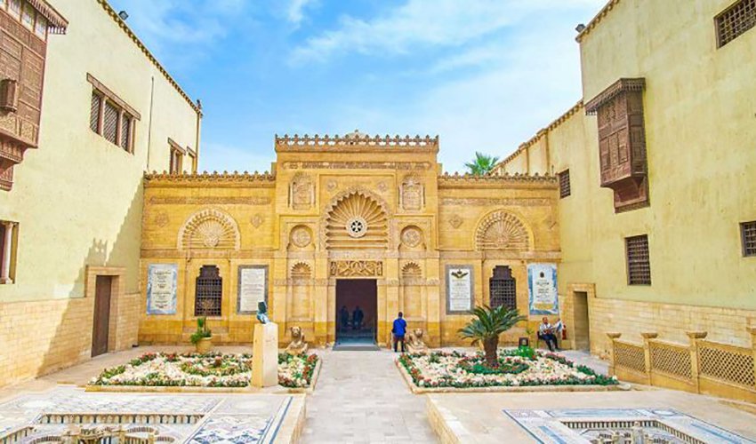 The Coptic Museum in Old Cairo with its traditional architectural style, ornate wooden carvings, and peaceful courtyard.
