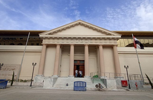 The Greco-Roman Museum in Alexandria with its restored façade, historic columns, and entrance surrounded by Mediterranean architectural details.