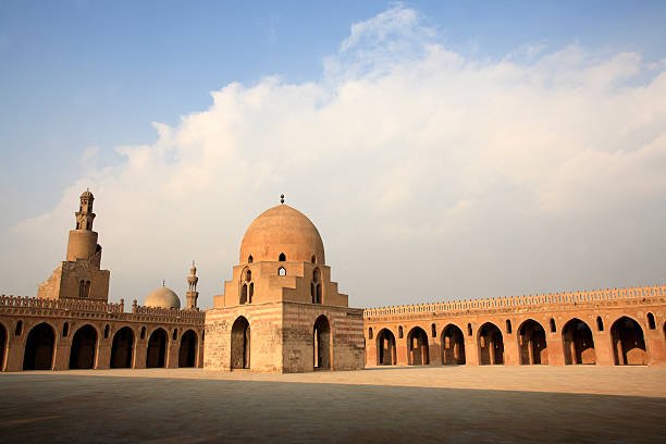 Ibn Tulun Mosque one of the oldest and the largest mosque in Cairo with the spiral minaret in the background.