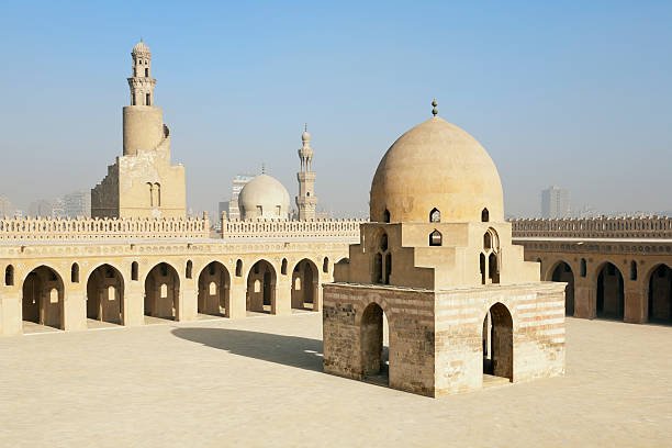 Cairo, Egypt, Africa. Ablutions fountain and spiral minaret in the central courtyard of the Mosque of Ibn Tulun. Islamic Cairo area (also called Fatimid Cairo).